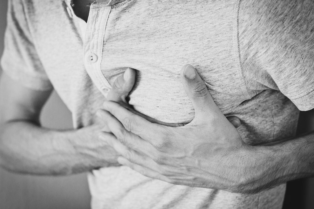 man suffering from heartburn